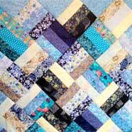 A "Jelly-Roll" quilt made from just one jelly-roll by Betty Hebditch from Victoria Fabrics.